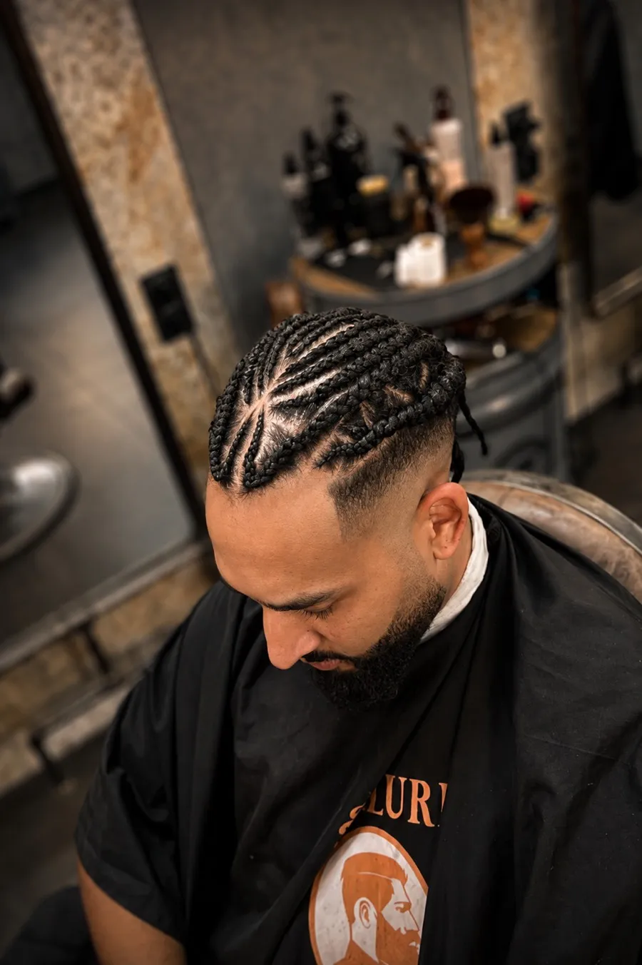 Tresses collées et dégradé progressif réalisés chez Allure Barber.
